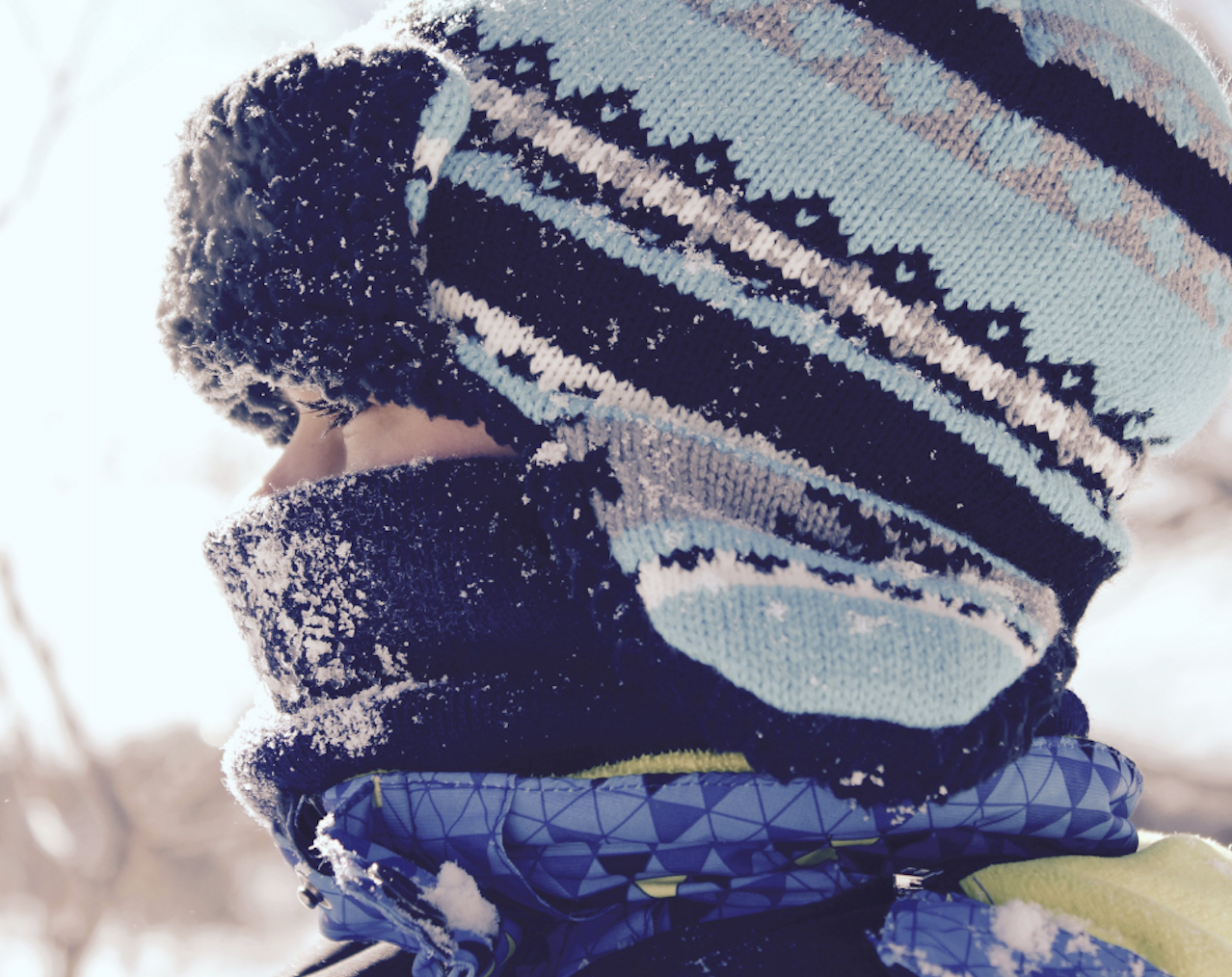 Child dressed for outdoor play and learning