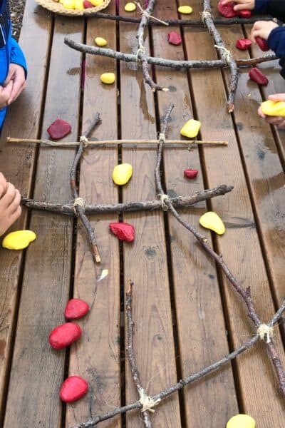 Rainy Day Play Ideas - Tic Tac Toe with rocks and sticks